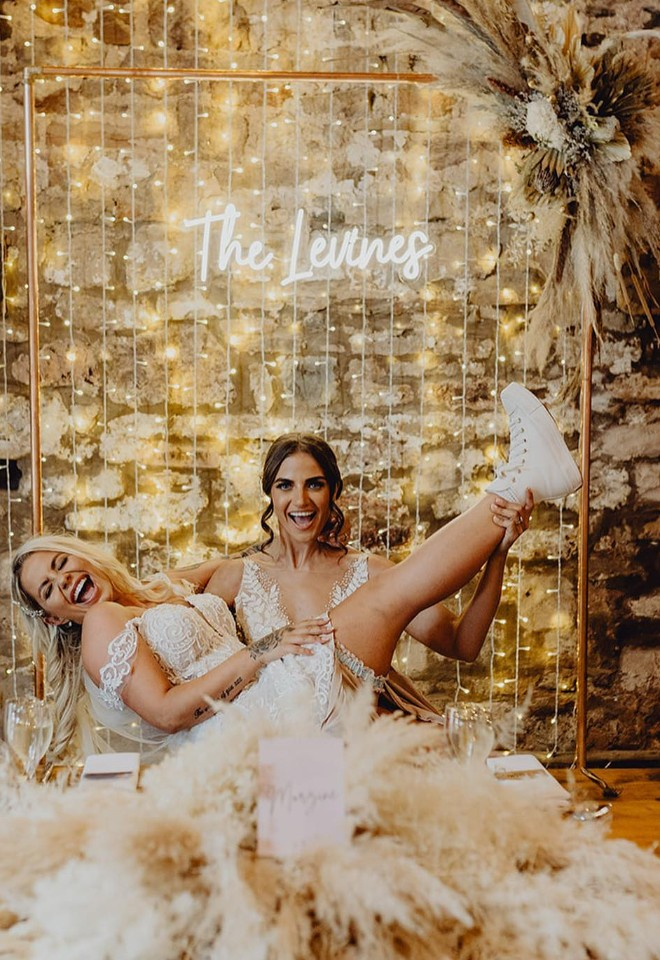 brides celebrating getting married at Eden Wedding Barn cumbria