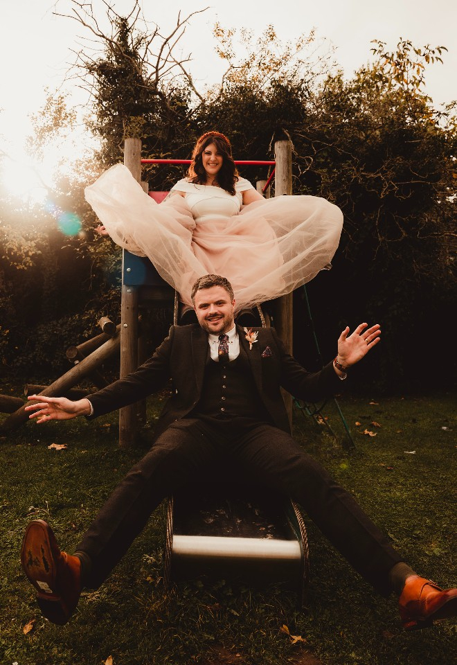 Bride and groom on a slide