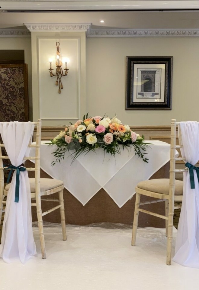 light pink and cream flower display as centre piece by hire heaven