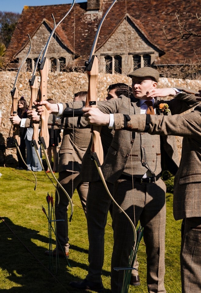 Groom doing archery