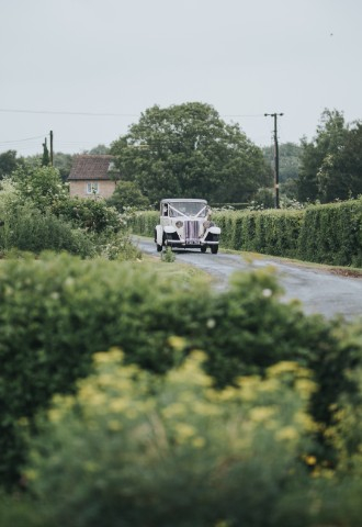 Vintage Wedding car approaching Widbrook Grange - a boutique country house wedding venue in The Cotswolds