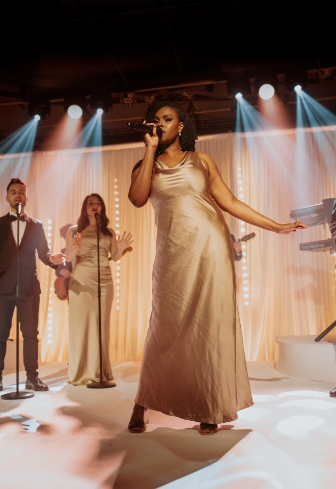 Singer performs in gold dress