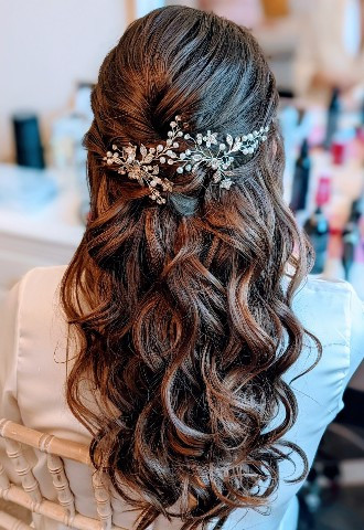 Soft textured boho waves half up half down bridal hair 
