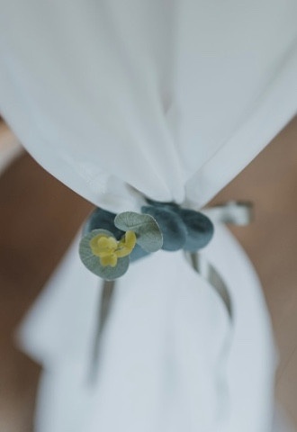 Ivory drapes with sage ribbon