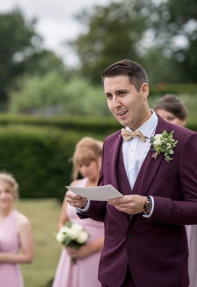 Groom making his wedding vows to his husband