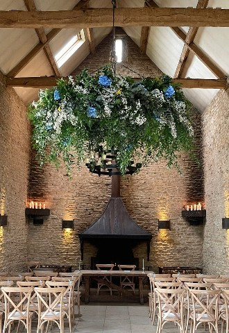 Stone Barn wedding floral ceiling display from Oops a Daisy in Cirencester