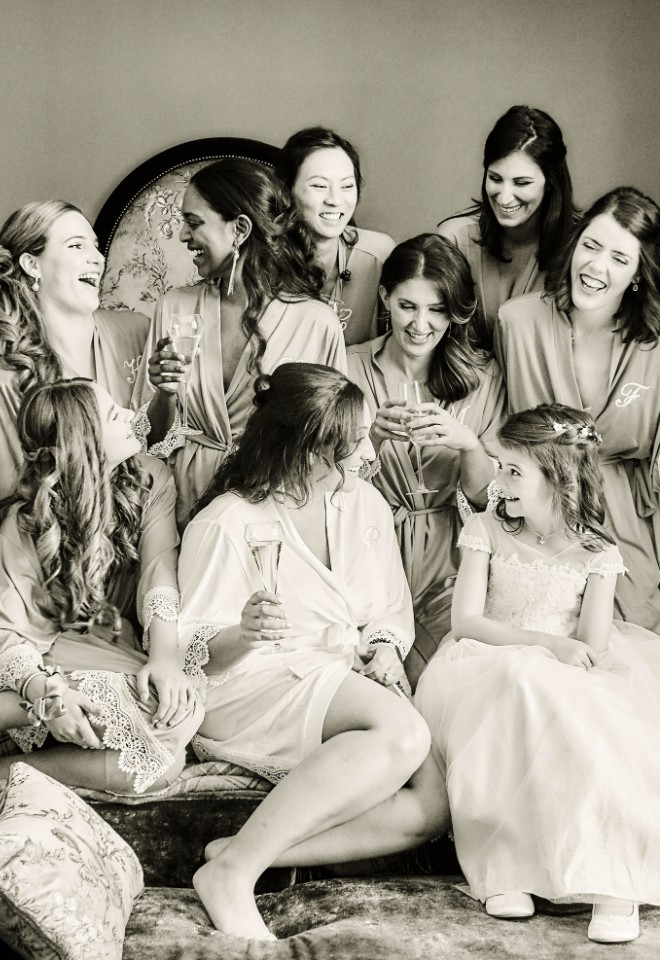 Bride and bridesmaids laughing at Cameron House wedding by Stuart Wood