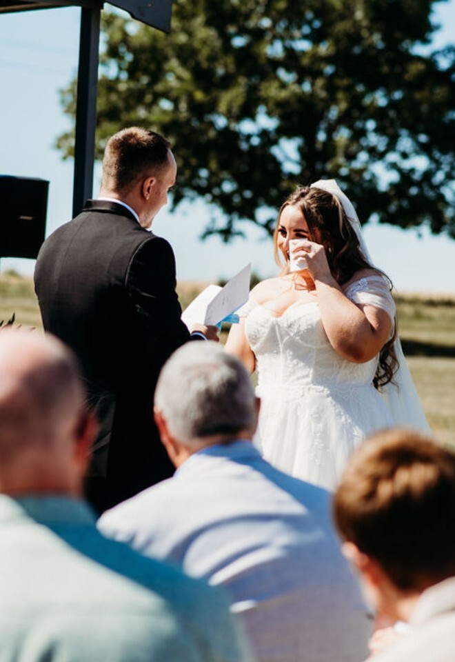Bride emotional during personal vows during Buckinghamshire wedding ceremony with celebrant