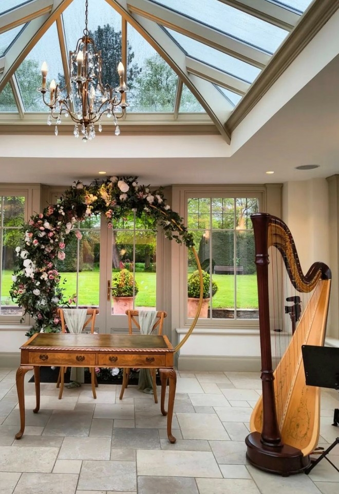 Wedding ceremony at Plum Park, harpist Noa Davies playing the wedding entrance