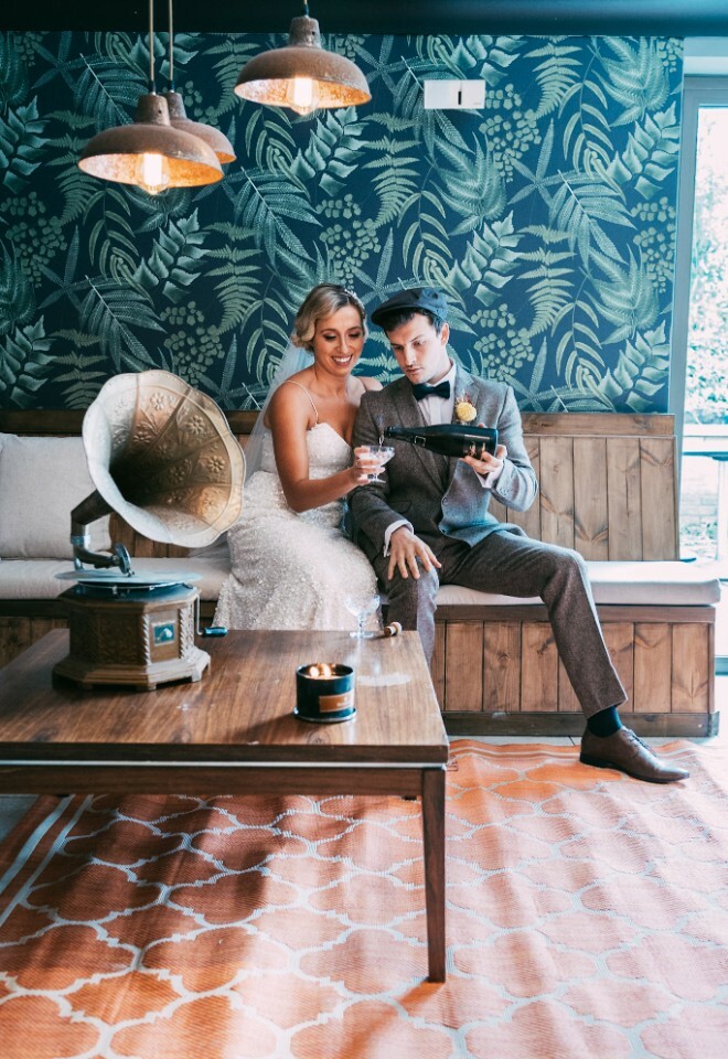 Wedding couple pour champagne