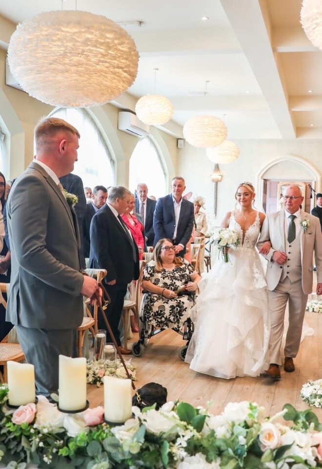 father of the bride walking her down the isle to the groom at Wennington Hall wedding venue