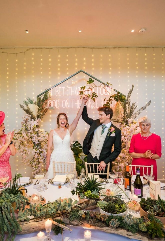 Bride and groom with family celebrating their wedding