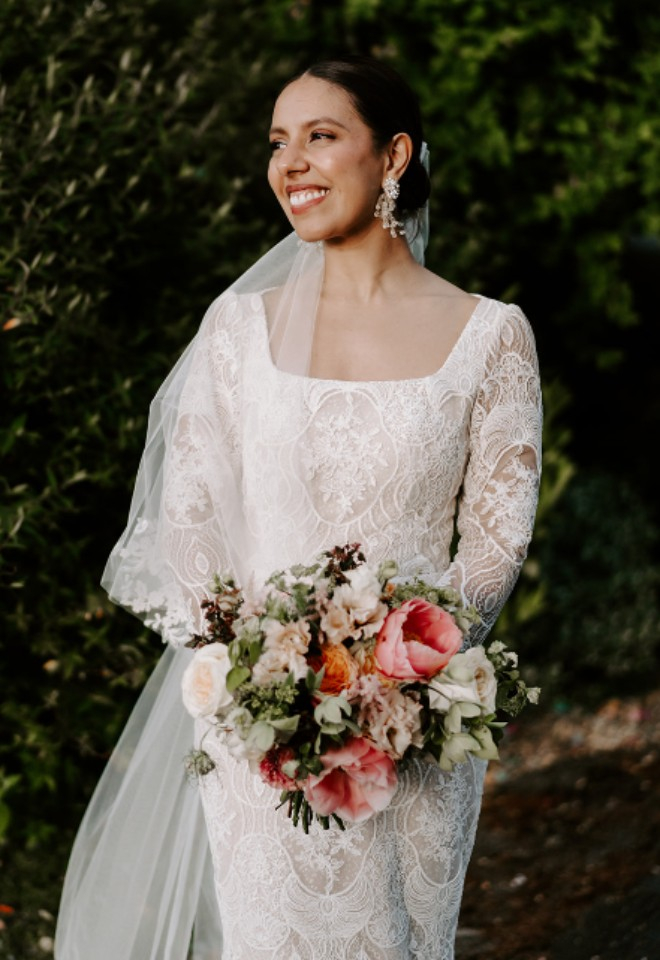 Spring wedding bouquet of peonies, roses, sweet peas, hellebores, eustoma and seasonal foliage at Offley Place