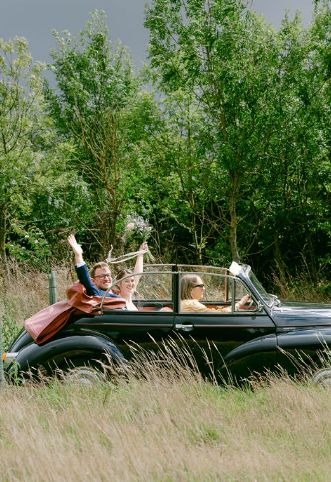 Bride and groom in the car at High Holcombe 