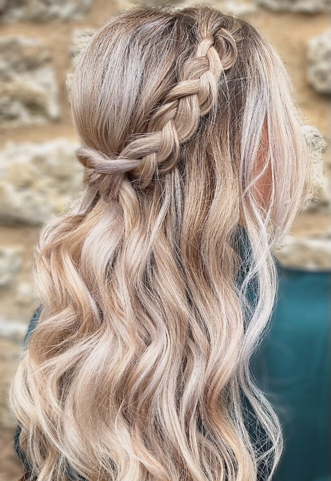 Wedding hair by Lauren Cohen Hair and Make-up Artist in Oxfordshire, featuring a half-up braided bridal style with long, soft blonde waves