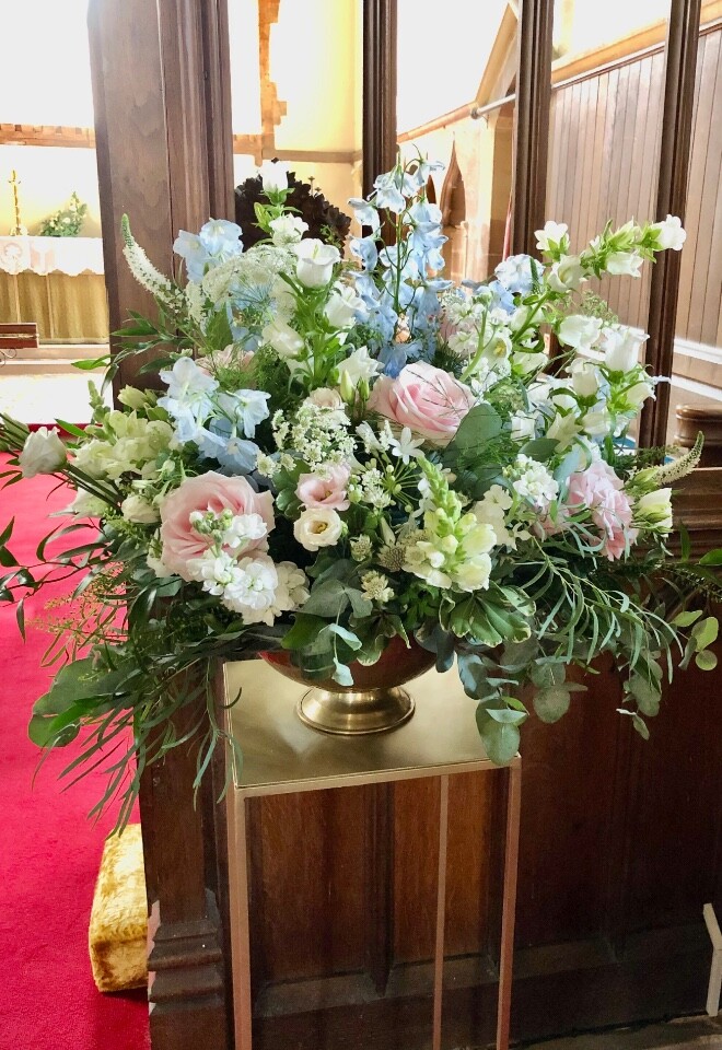 A gorgeous pedestal arrangement in delicate pale pinks, whites and blues for a church wedding and Kingston Bagpuize House reception 