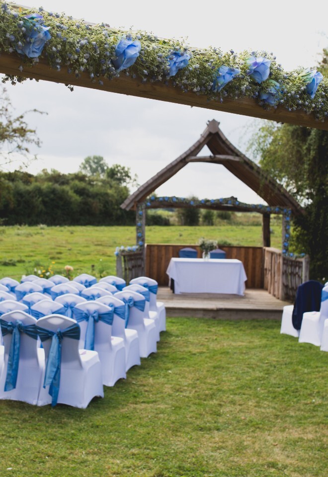 A blue colour scheme outdoor wedding at the Clifden Arms in Worminghall