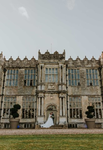 Bride and groom outside Howsham Hall, North Yorkshire