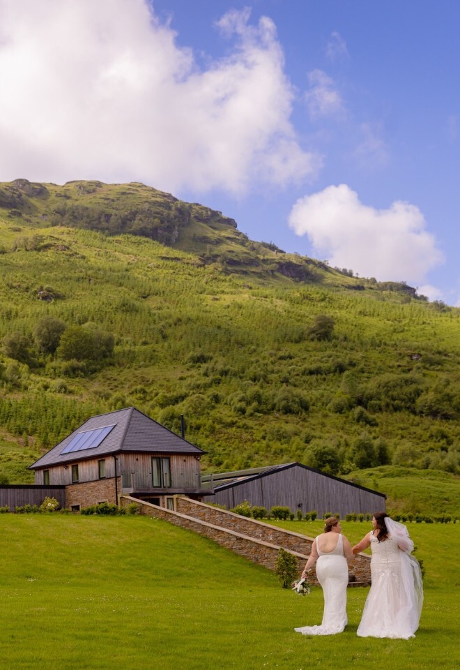 Countryside wedding venue, brides walking towards the main celebration areas