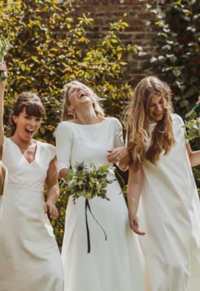 Bride and maids of honour laughing