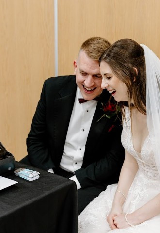 Bride and groom watching their caricature come to life