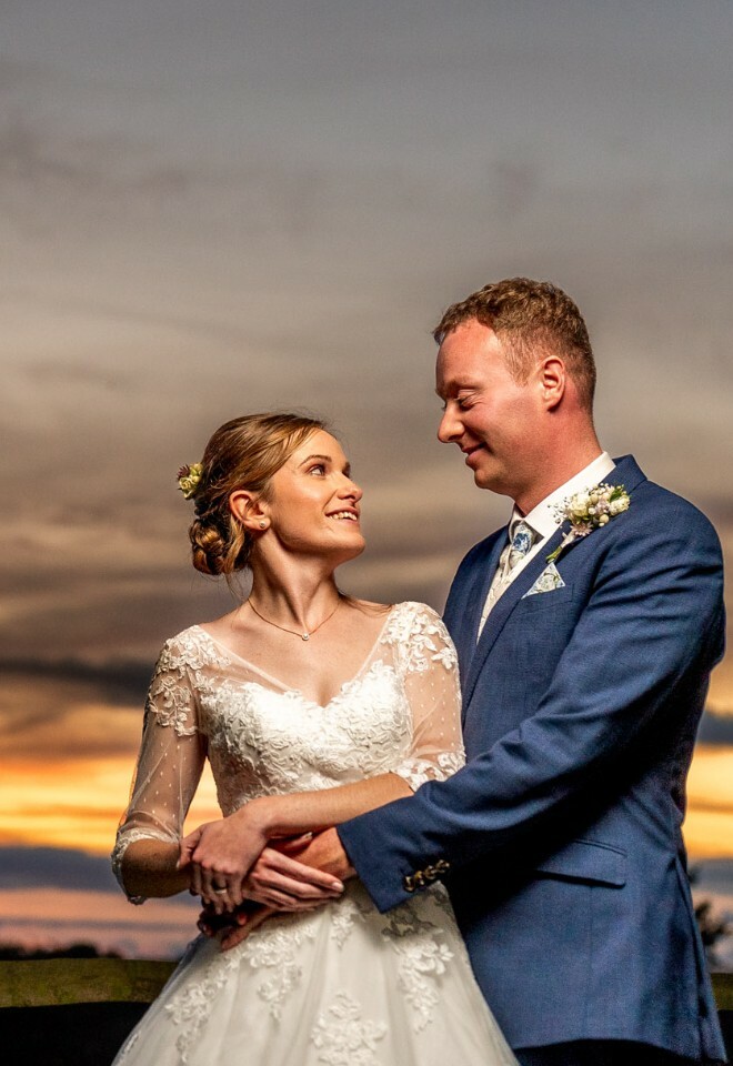 bride and groom at sunset