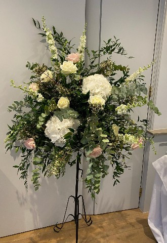 wedding floral display made up of blush roses and white hydrangeas with lots of green foliage by ann laing flowers, harwell, oxfordshire 