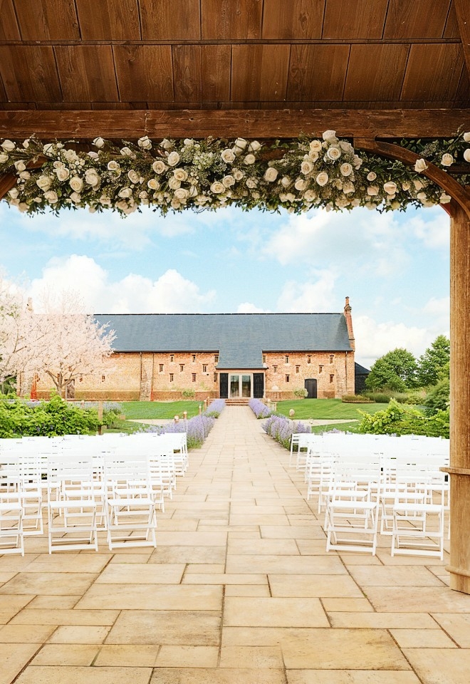 The new outdoor ceremony area with beautiful Pergola at Copdock Hall wedding venue Suffolk