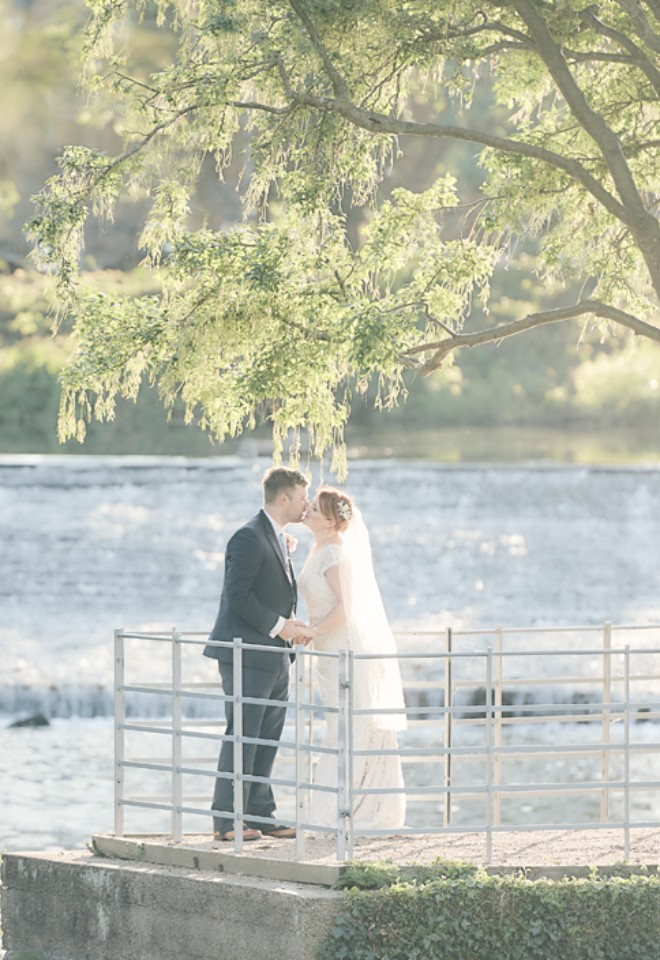 image of couple by the waterside at West Mill taken by Stuart Wood Wedding photography