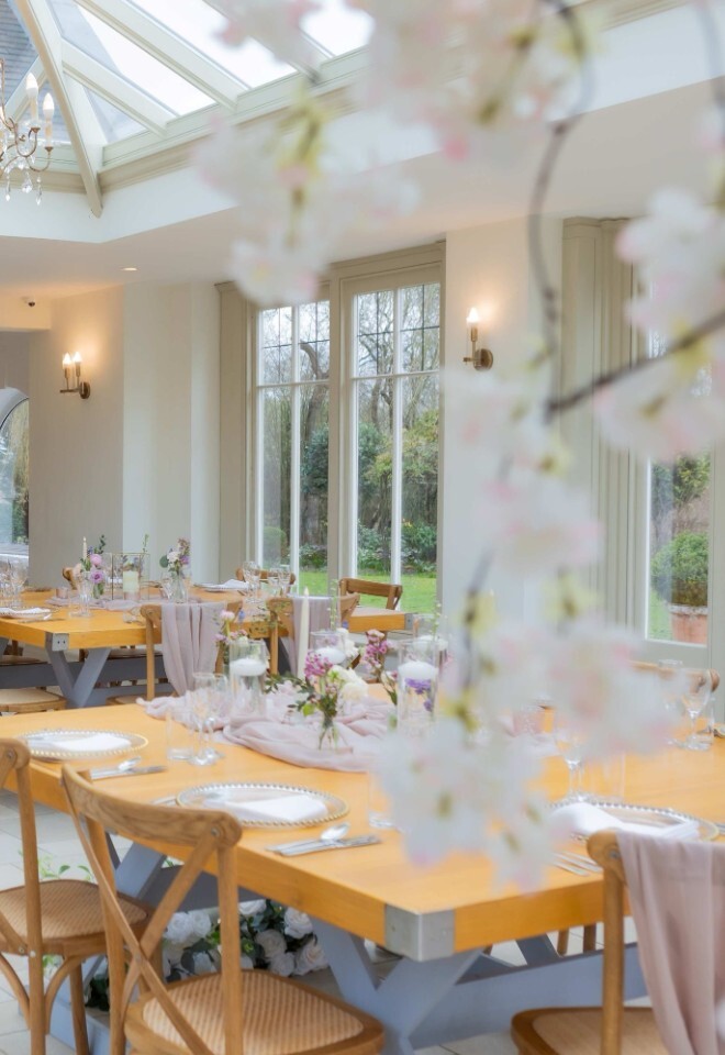 A dining setup in the orangery at a country wedding venue in Northamptonshire