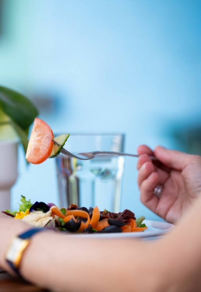 Fresh Salad Being Eaten