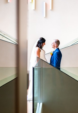 Bride and groom with reflections on the staircase at The Ashmolean Museum 