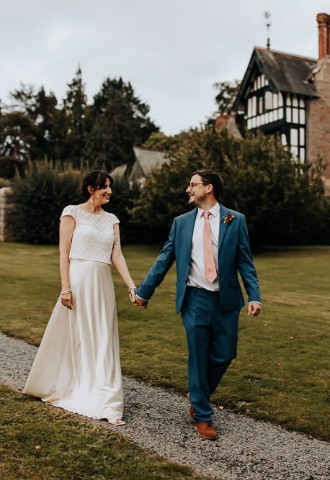 Bride and groom exploring the grounds at Plas Dinam, Powys