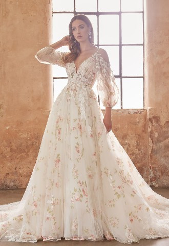 Romantic & modern this delicate lace-overlay floral gown with its bell, off the shoulder sleeves, & delicate beaded straps that criss-cross at the back Josephine Scott