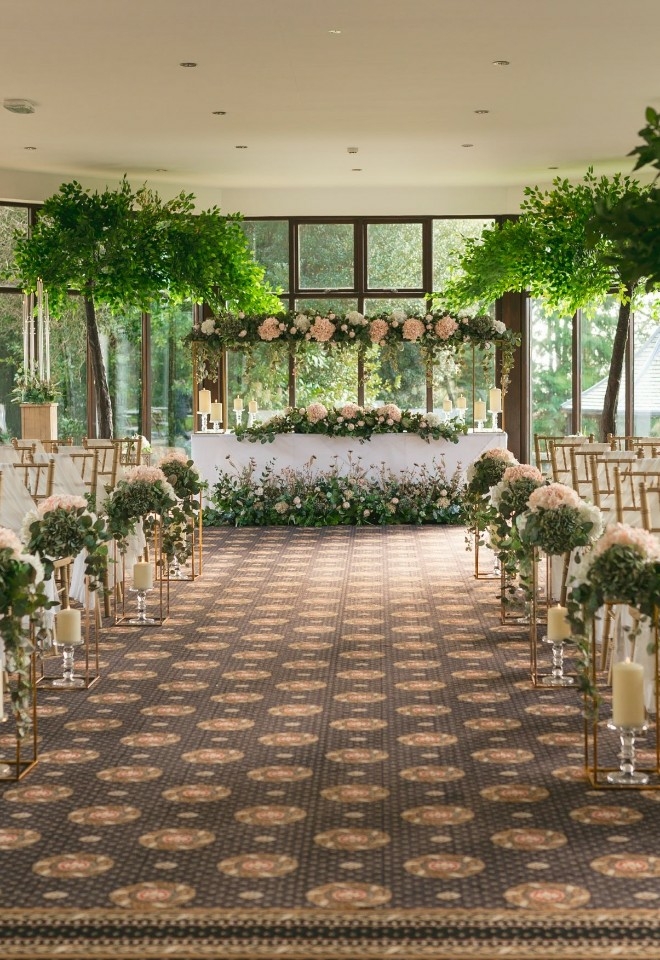 Garden Room set up for a ceremony with inhouse venue dressing services