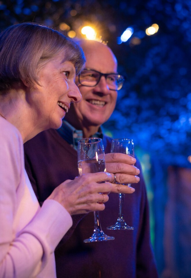 Guests Celebrating Over Bubbles in the Whispering Woods