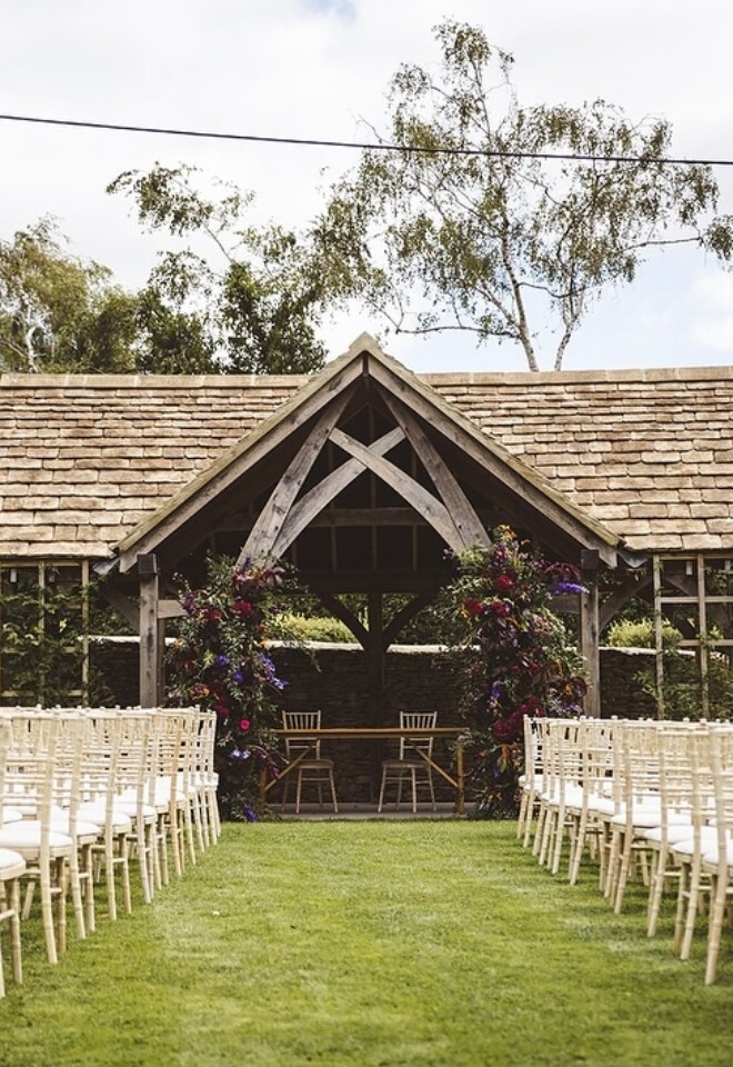 outdoor wedding ceremony set up at The Great Tythe Barn in Gloucestershire 