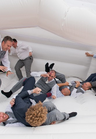 Groom and groomsmen collapse bouncy castle