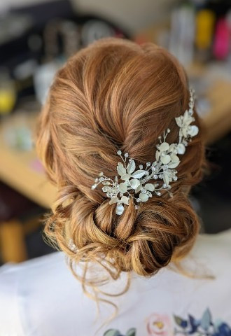 Romantic modern updo with delicate hair accessory