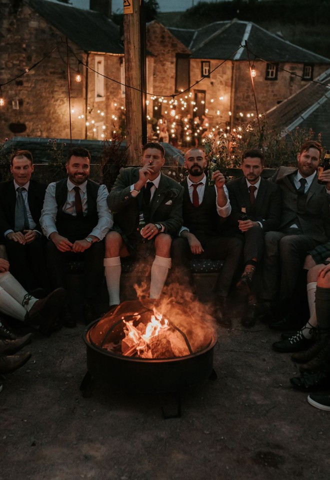 Gathered around the fire pit during the evening at Folkerton Mill. Photo by Mairi Tiffoney Photography