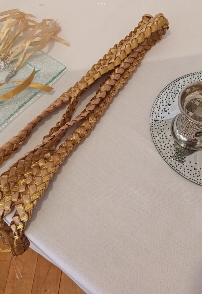 Handfasting ribbons with additional charms given as blessings by VIPs. Also quiche and crystal jug 