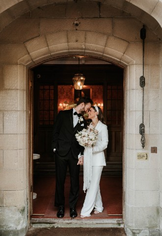 Departing Wedding couple at Entrance Melville Castle - a castle wedding venue near Edinburgh