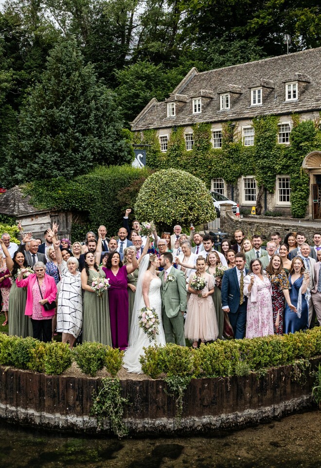 Group shot of the wedding party in front of The Swan Hotel