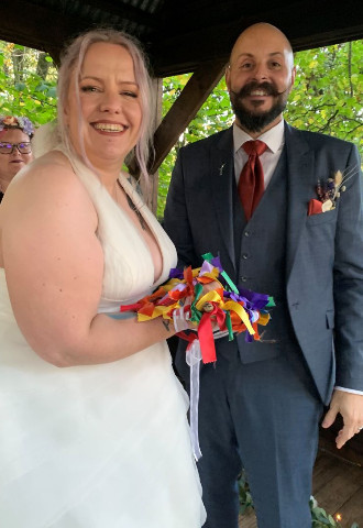 Handfasted couple with hoop and wand