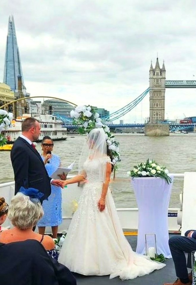 Jennifer Patrice, an experienced Independent Celebrant, with a happy couple on their wedding day, delivering an authentic, joyful, and personalised ceremony in a beautiful setting.