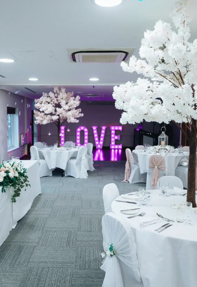 Wedding reception space set for wedding breakfast and dancing