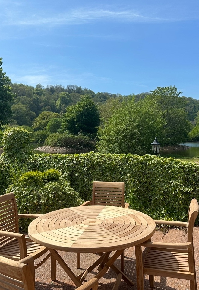 Outside the main hall , seating area looking on to the lake
