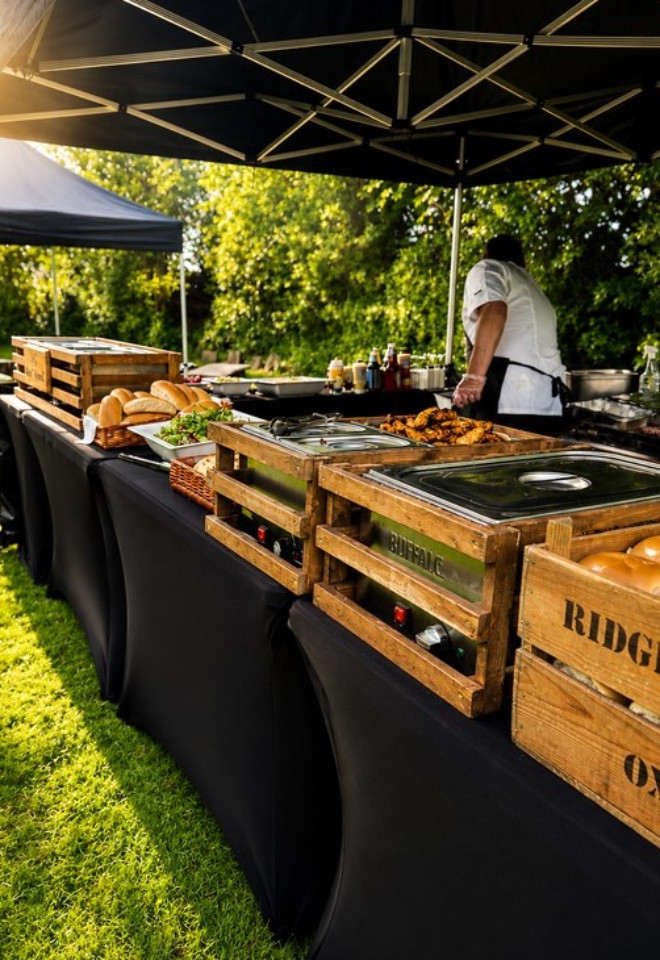 Outdoor hog roast and BBQ catering setup at a Lancashire wedding