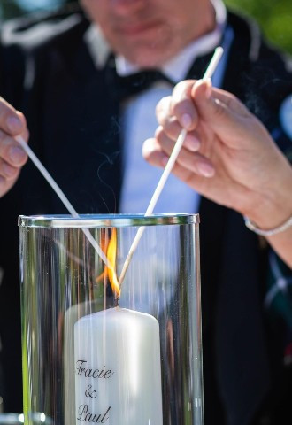 Wedding Couple lighting a Family Unity Candle during a Celebrant Wedding performed by Pure Silk Ceremonies