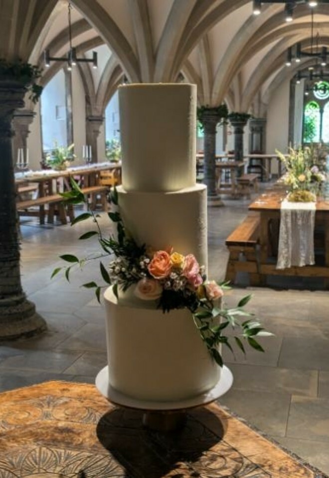 White ganache cake with fresh florals